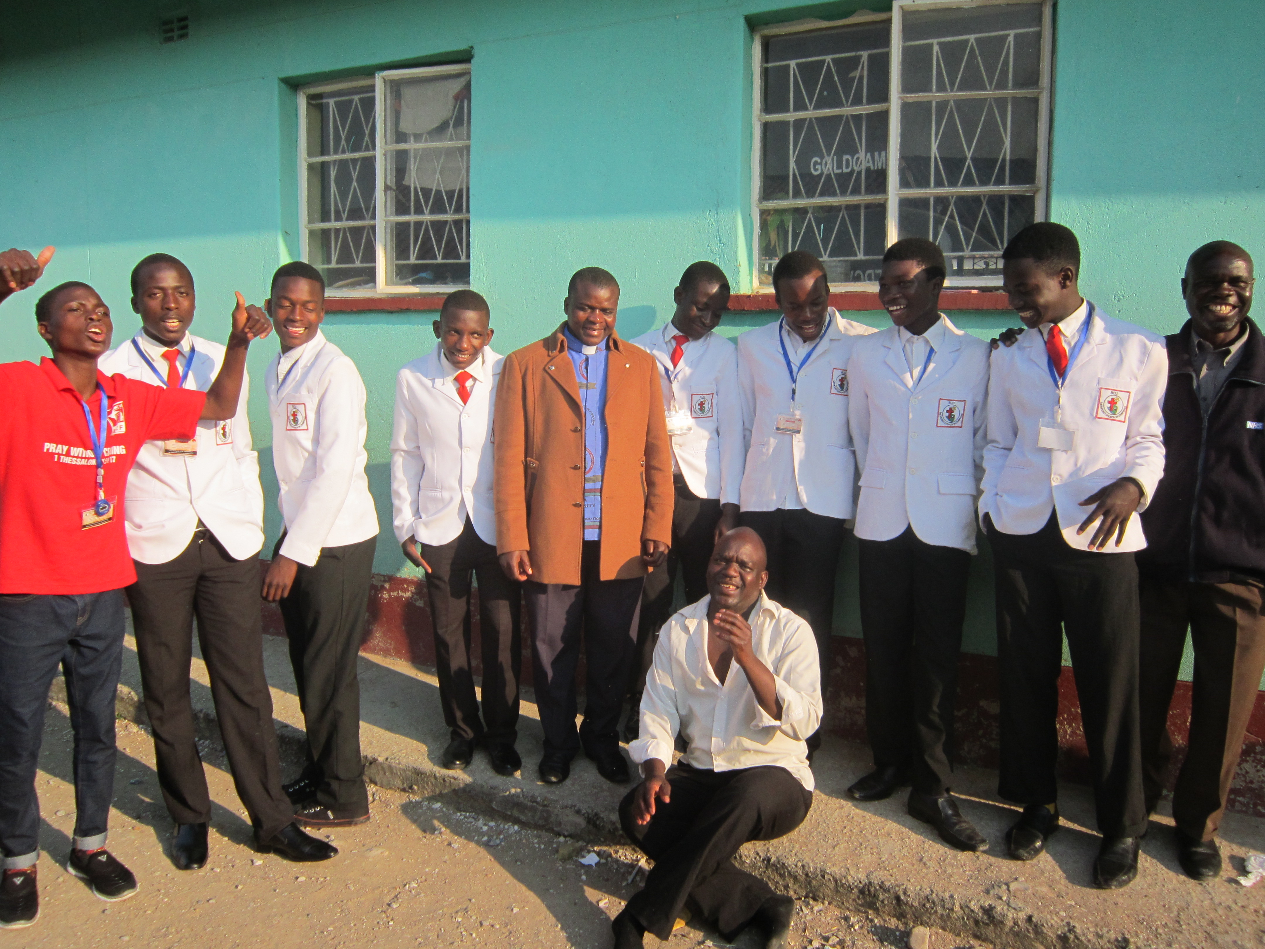 A group of teenage boys attending a Christian Union gathering are proud of their uniforms