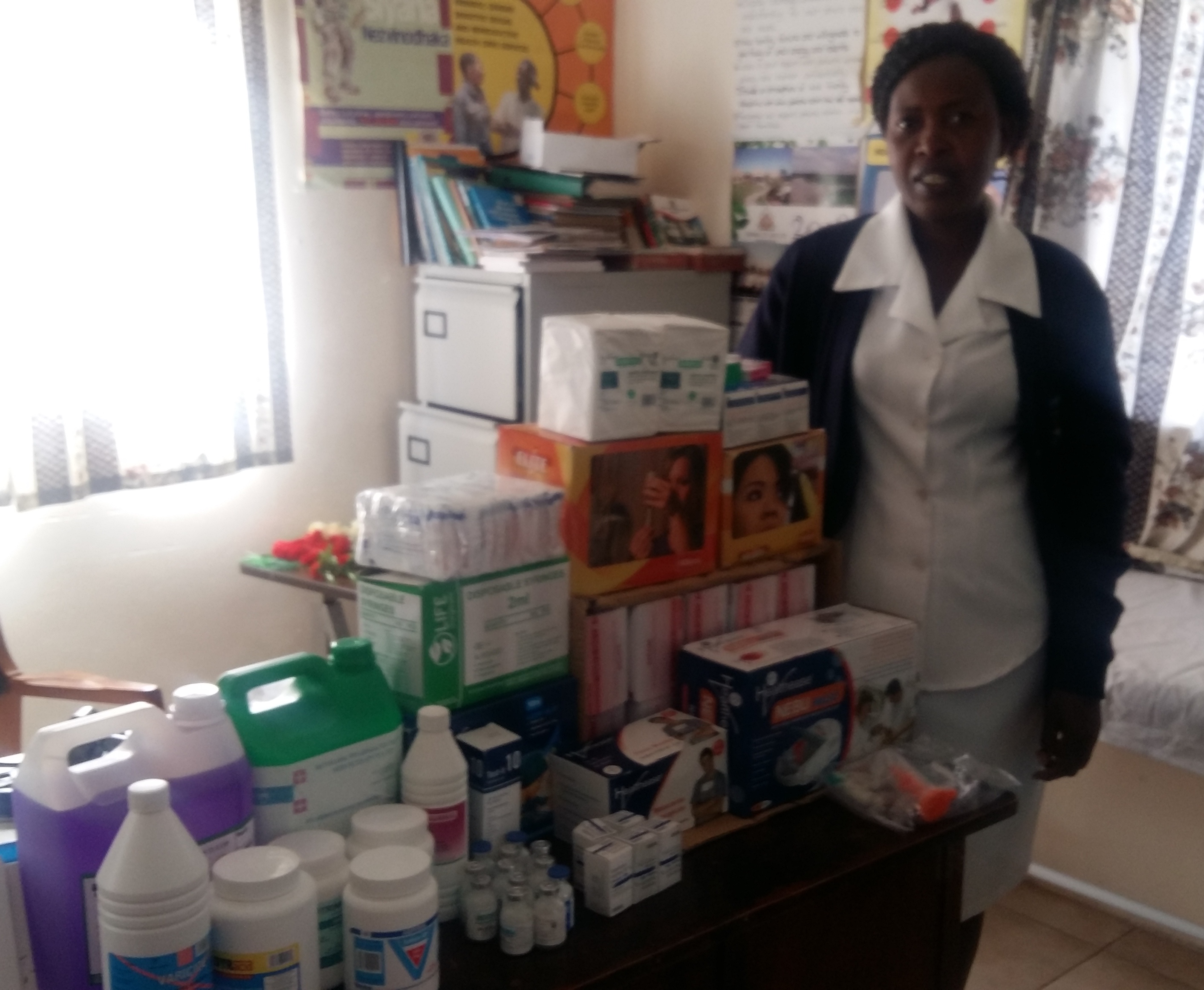 In the clinic - this is Litta, the Registered Nurse. She was so relieved to receive a donation of £500 to spend on items for the clinic